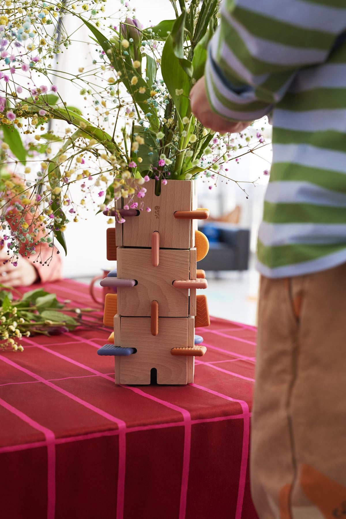 portrait of kid proud of BAVVIC wooden creation
